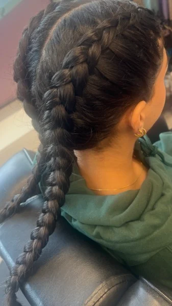 Two braids joined into a long braid at the back